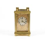 A c1900 brass carriage clock, in exhibition case, the dial with Roman numerals and highly attractive
