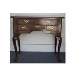 A George III mahogany lowboy, with overhanging top moulded edge, one long drawer above three