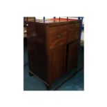 A Regency mahogany buffet, with two cellarette drawers above flame mahogany panel doors, possibly