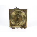 G C Stringer of Stockport, a brass long case clock movement with both Roman and Arabic numerals,