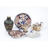 A group of Oriental ceramics, including a cloisonné vase and an Imari plate in a painterly style