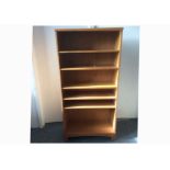 A contemporary oak veneered floor standing bookcase, five adjustable shelves, 70cm x 30cm x 142cm