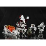 A group of Swarovski Christmas figures, to include Father Christmas, reindeer and sleigh, snowman