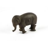 A novelty cast iron walking elephant, likely Edwardian era bearing impressed marks 'Patent 1873',