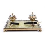 A late 19th/early 20th Century gilt metal and champlevé enamel desk stand set, with a stone base