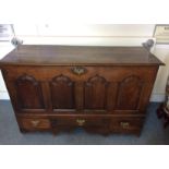 A substantial oak and elm 18th Century mull chest, four panelled front above three short drawers,