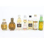 A quantity of assorted whisky miniatures, including examples by Bells, J&B, Haig, Thatchers and