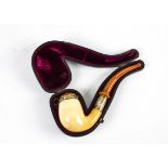 A carved amber and meerschaum pipe, metal mounted, and in original velvet lined case, length 17.5cm