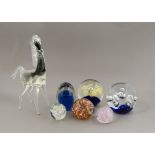 A selection of 20th Century paperweights, of assorted colours and designs, including a set of