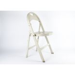 A child's folding chair manufactured by Thonet, designed 1904-1905, the back seat formed to create a