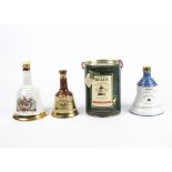 A collection of Bell's Scotch Whiskey commemorative porcelain decanters, celebrating royal births,