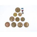 A selection of 20th Century French commemorative medallions, featuring historical figures and