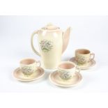 A 1930's Susie Cooper kestrel shaped coffee set for two, in the Dresden Spray (pink) pattern,