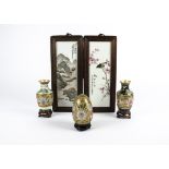 A pair of Chinese Republic Period famille rose plaques, one depicting a bird perched on a branch,