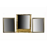 Three gilt framed mirrors, one with gilt column surrounds measuring 62cm x 54cm, the others a pair