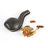 A carved 19th Century meerschaum pipe, taking the form of a Blackamoor, in original case, length