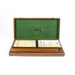 A mid Century mah jongg set produced by E.V.B Plastics Ltd, complete with Jacques and Son Rule