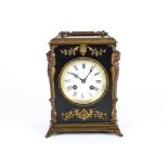 A 20th Century Regency style mantle clock, white tin plate dial with Roman numerals, within a
