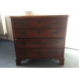 A reproduction Georgian mahogany chest of drawers, with four long graduated drawers, raised on