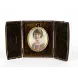 A 20th Century gouache on ivory miniature of a young woman, unsigned, within a gilt oval frame,