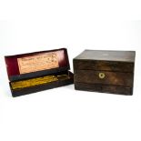An antique treen and brass bound writing slope with black lining, and multiple compartments, 35cm