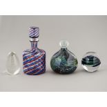 A Mdina glass heavy desk weight, together with a studio glass bottle with internal twisted blue