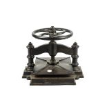 A cast iron book press, stamped with naval anchor, height 33cm