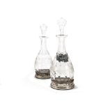 A pair of modern silver wine bottle coasters from B & Co, together with a good pair of cut glass