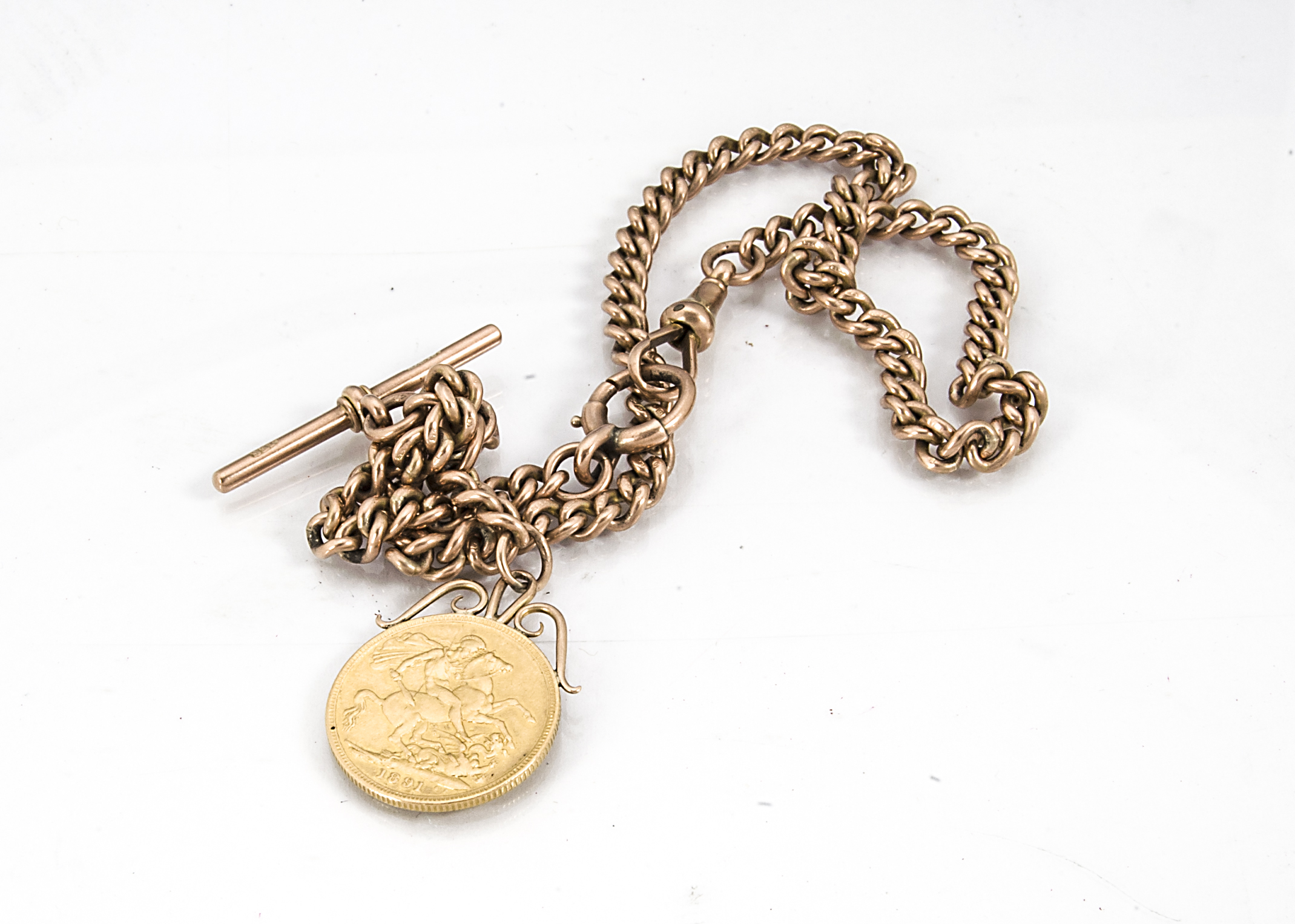 A late Victorian 9ct gold watch chain and sovereign, the 1891 Jubilee Head full sovereign having