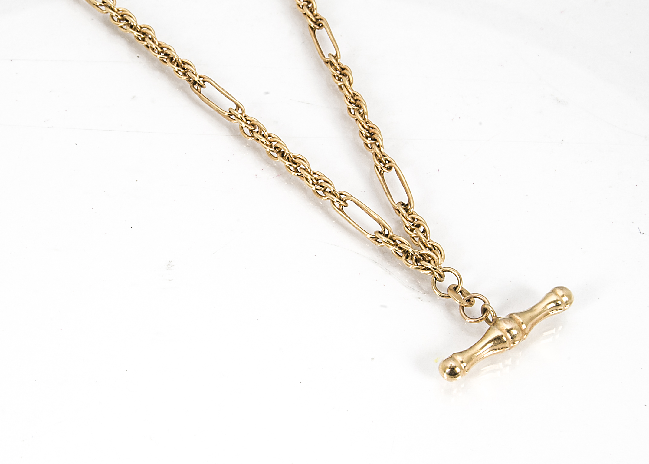 A contemporary 9ct gold watch chain, with fancy links and hollow T bar, 8.2g, 46cm