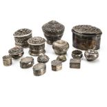 Twelve late 19th and early 20th century Indian and Middle Eastern white metal boxes, seven being