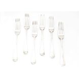 A set of nine George III silver dinner forks and four others, Old English pattern bearing family