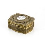 A late 19th century gilt trinket box, having ivory circular painted with a painted portrait of a