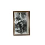 Robert Johnson, a framed and glazed poster: 'King of the Delta Blues' depicting Robert Johnson