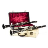 Clarinets, two wooden clarinets, a Buisson, Paris with two mouth pieces and a Normandy serial no: