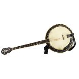 Banjo, an un-named four string banjo with resonator with some discoloration of skin and repairs to