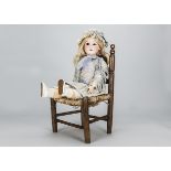 A large Simon & Halbig 1349 Jutta child doll, with blue sleeping eyes, blonde mohair wig, jointed