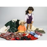 A Trendon Sasha doll and outfits, with dark hair, a blonde baby, tartan Ballet cape, Gingham