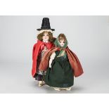 Two German bisque shoulder head dolls, one marked 74 dressed in Welsh traditional costume with