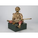 A rare late 19th century Indian musician automaton, carved and painted wood, pierced ears with large