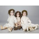 Three German child dolls, a Kley & Hahn Walkure —23in. (58cm.) high; an Adolf Heller and AM