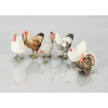 Five German composition chickens, with metal feet —3in. (8cm.) high; and a turkey