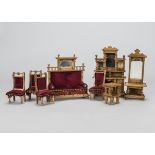 A German oak dolls’ house set, a two seater sofa with mirror above —7in. (18cm.) high, a buffet, a