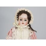 A Simon & Halbig for Kammer & Reinhardt child doll, with blue sleeping eyes, brown mohair wig,