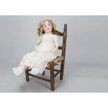 A Max Handwerck 283 child doll, with blue sleeping eyes, replaced blonde mohair wig, jointed