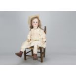 A large Armand Marseille child doll, with blue sleeping eyes, blonde hair wig, jointed composition