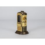 A German chocolate dispenser saving bank, lithographed tinplate in cream and black with gold lining,