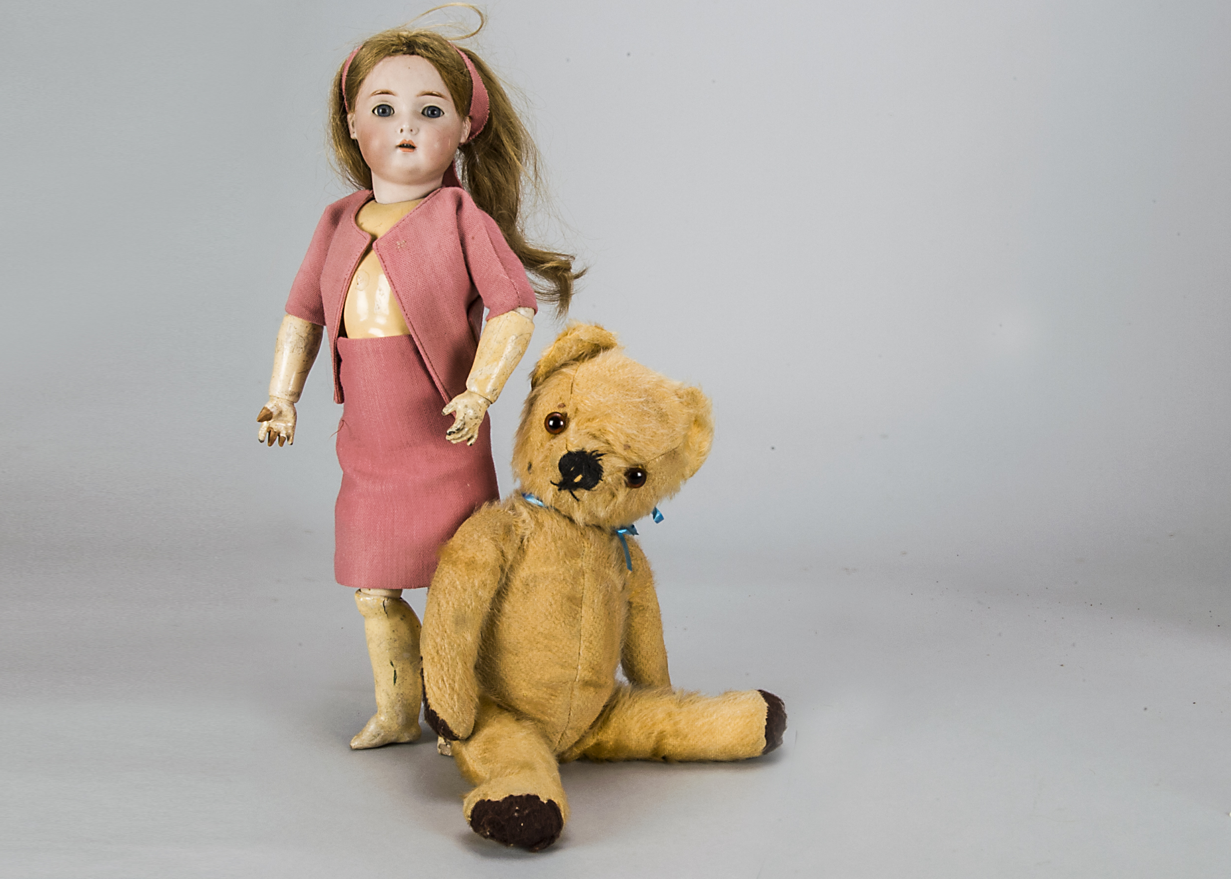 A Simon & Halbig for Kammer & Reinhardt child doll, with blonde sleeping eyes, pierced ears,