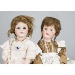 Two Ernst Heubach 250 child dolls, with blue sleeping eyes, jointed composition bodies, one with