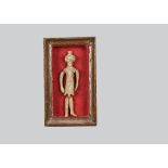 A small ancient Greek style terracotta doll or puppet, the torso and head in one piece with